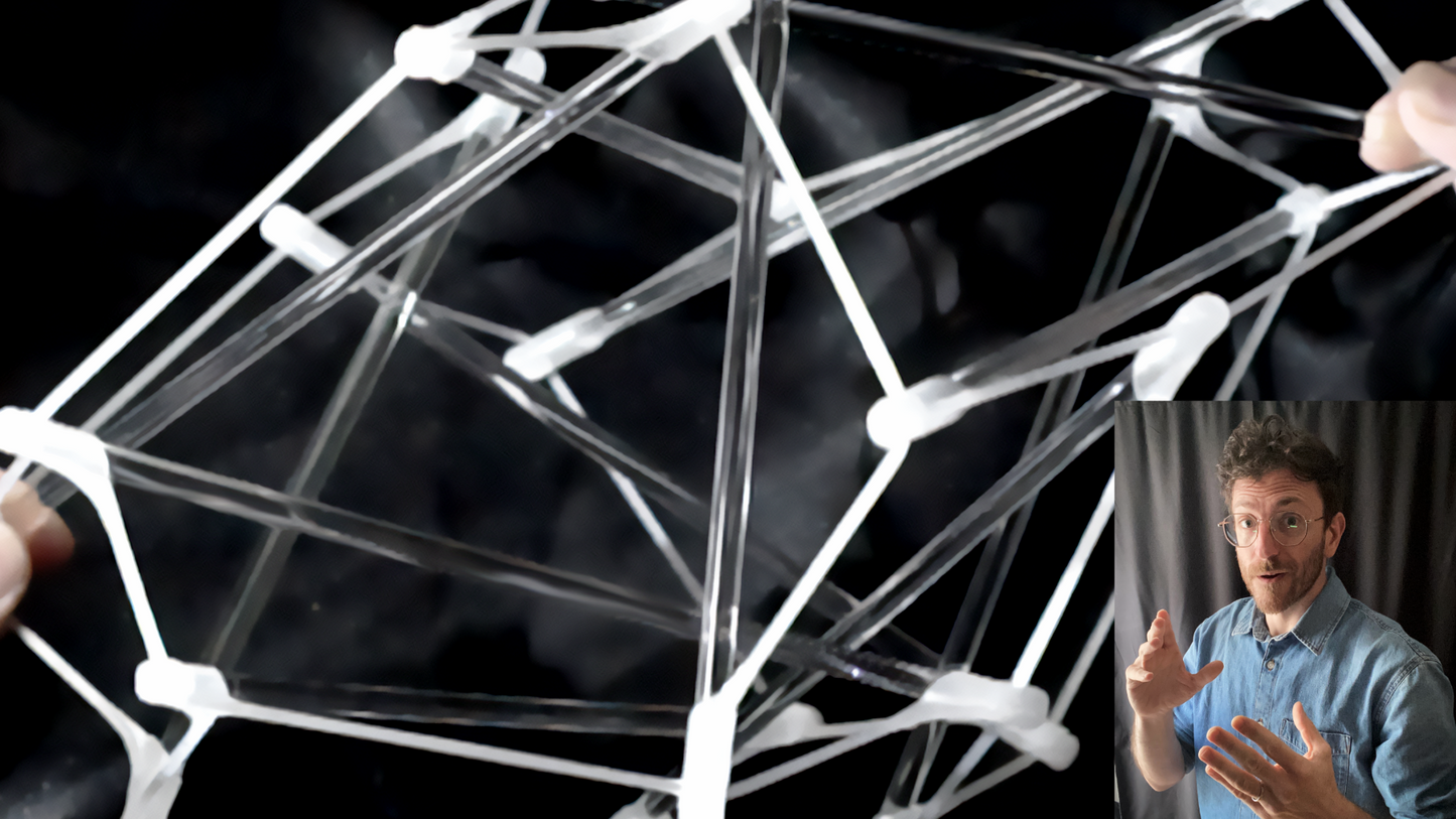 Geometric structure made of clear rods with a person in a small inset showing gestures.